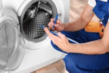 Man fixing a washing machine