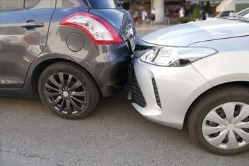 two cars touching after a collision