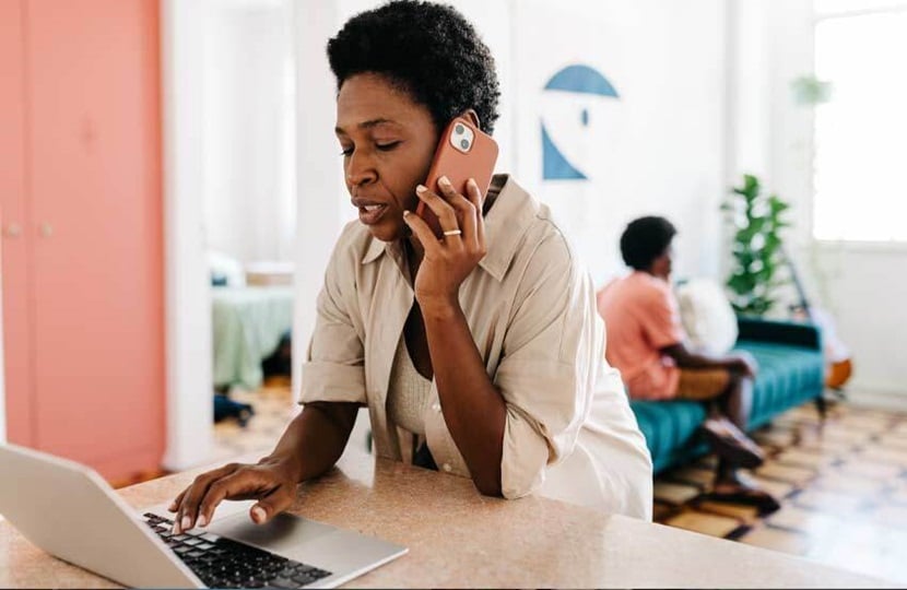 person on the phone cancelling their car insurance