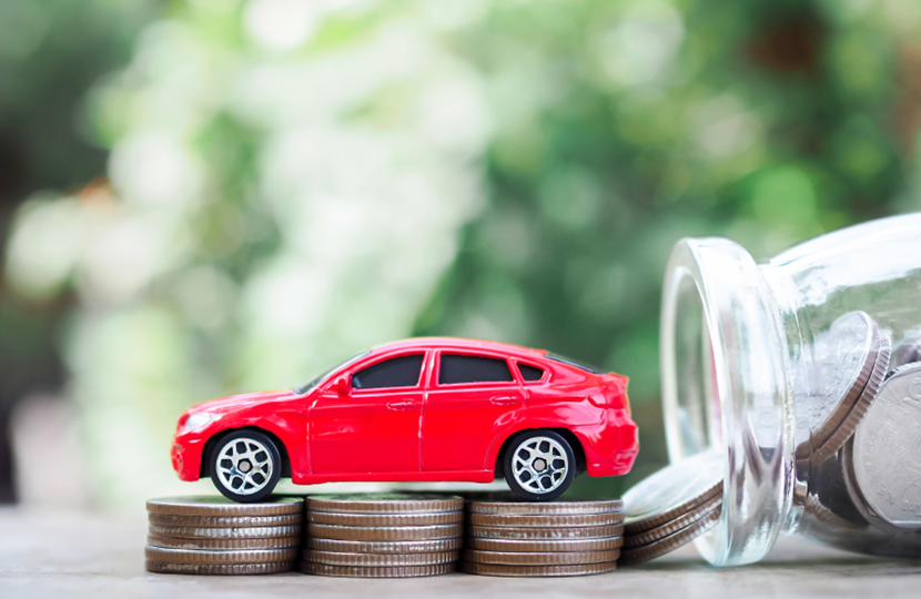 toy car sat on top of coins