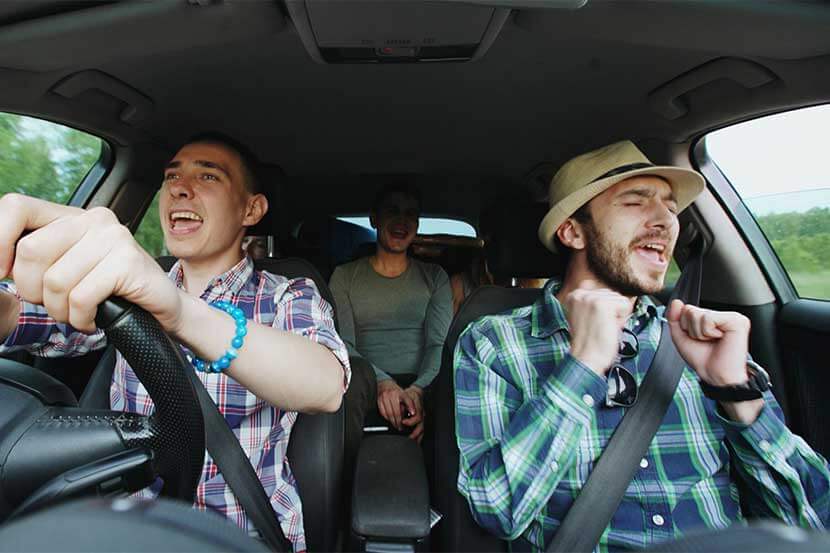 Friends in a car, sharing the driving