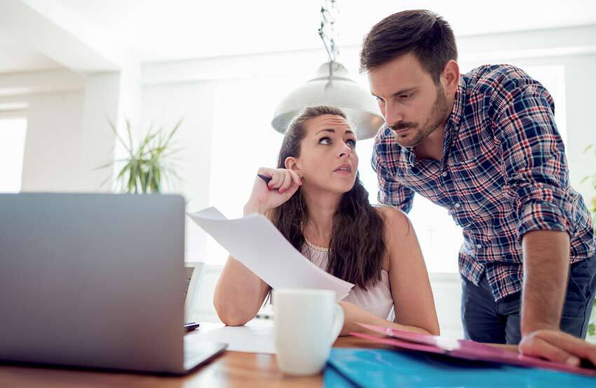 Woman and man looking at paperwork