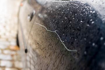 car door with a key scratch mark