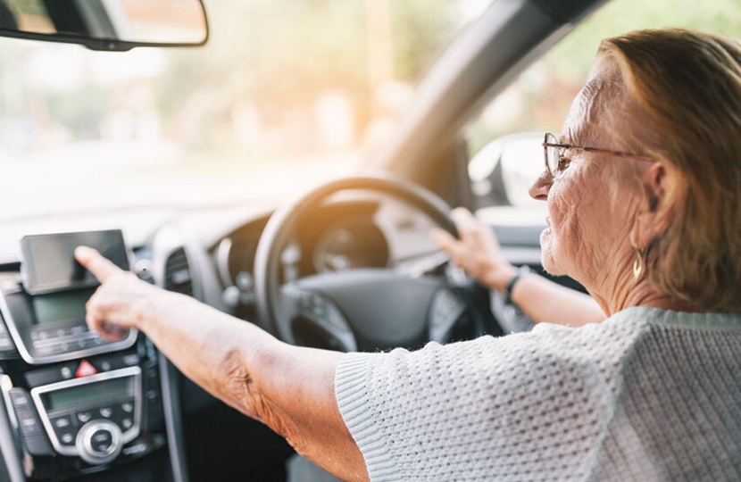 older person driving a car