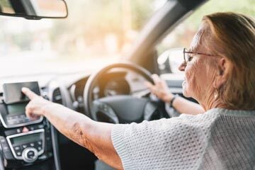 older person driving a car