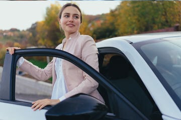 Woman exiting a car