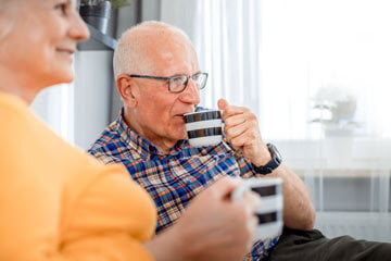 Elderly couple drinking tea