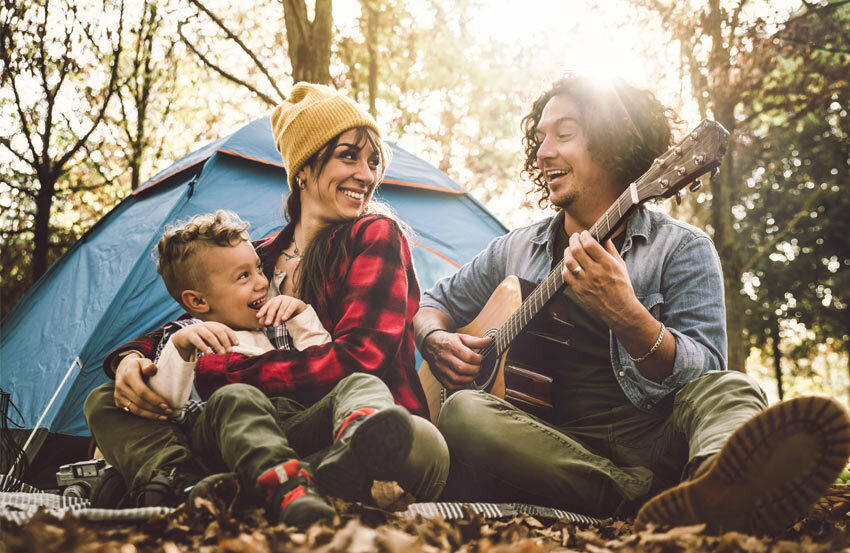 family on a camping holiday in the woods