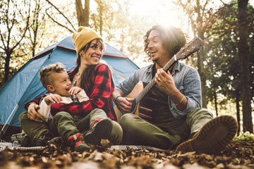 family on a camping holiday in the woods