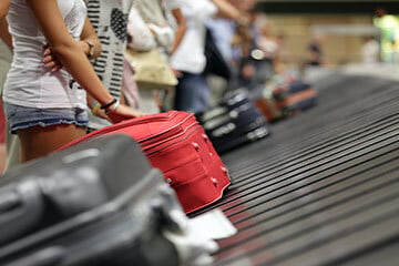 Suitcases on airport luggage carousel