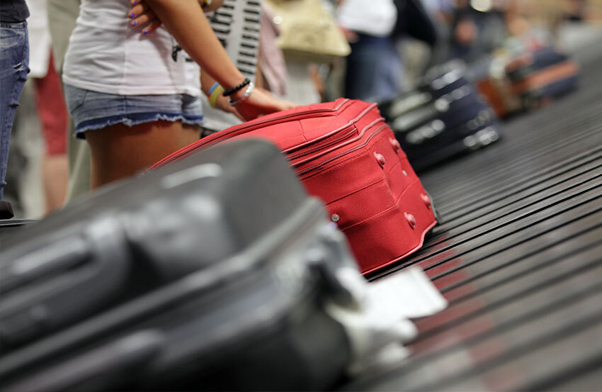 Suitcases on airport luggage carousel