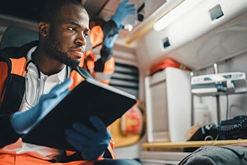 Medic holding a tablet