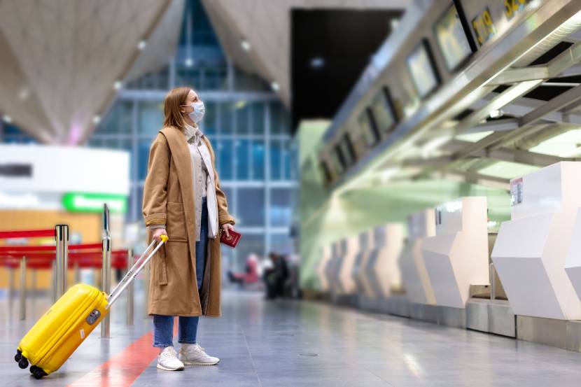 person looking at departure board