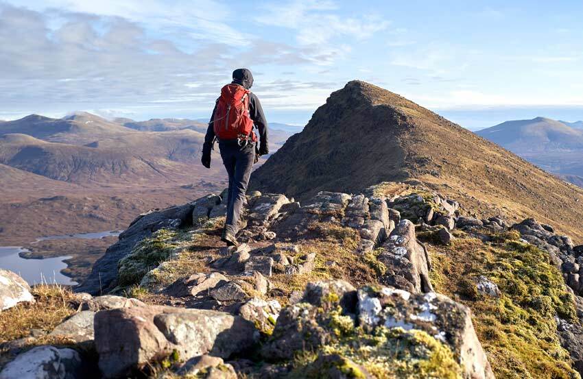 person walking up a mountain