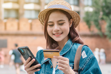 person looking at a travel card