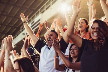 Sports fans cheering in a stadium